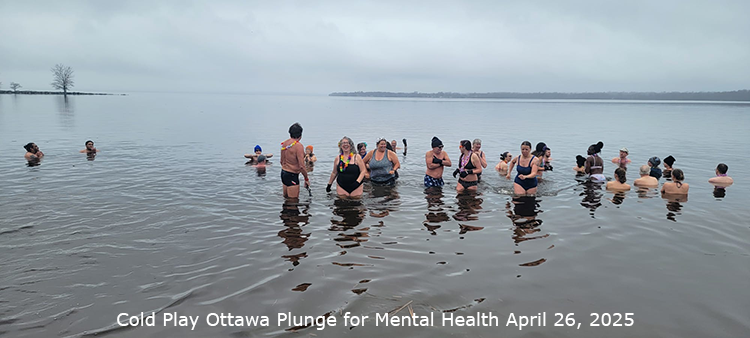 Community Event: Cold Play Plunge. People standing in cold water.