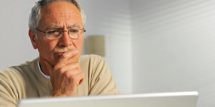 Man filling out an online complaint form